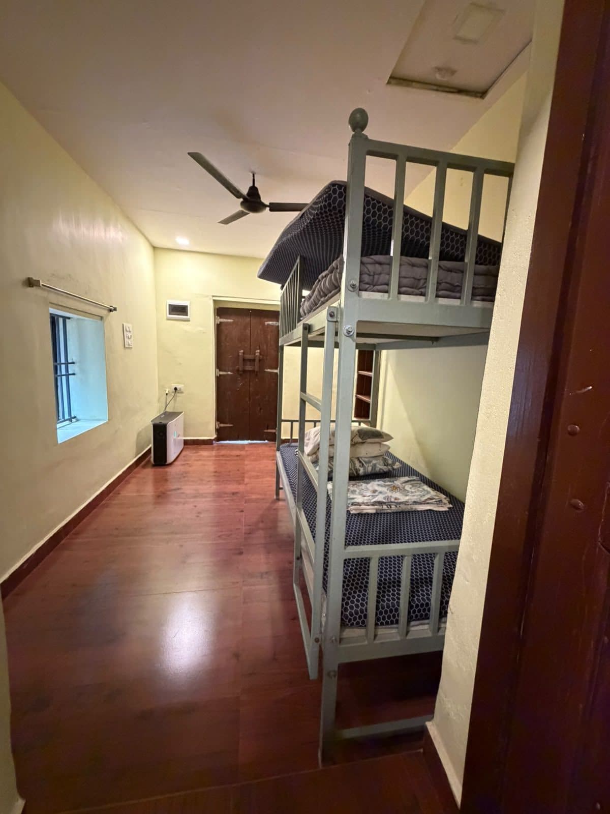 Bunk room with old wooden entrance door
